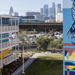 Mural of a bird on a building overlooking downtown los angeles